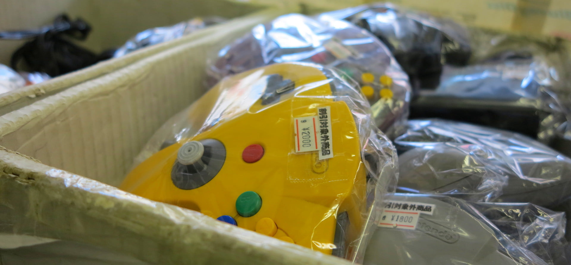 Box of Nintendo 64 controllers.
